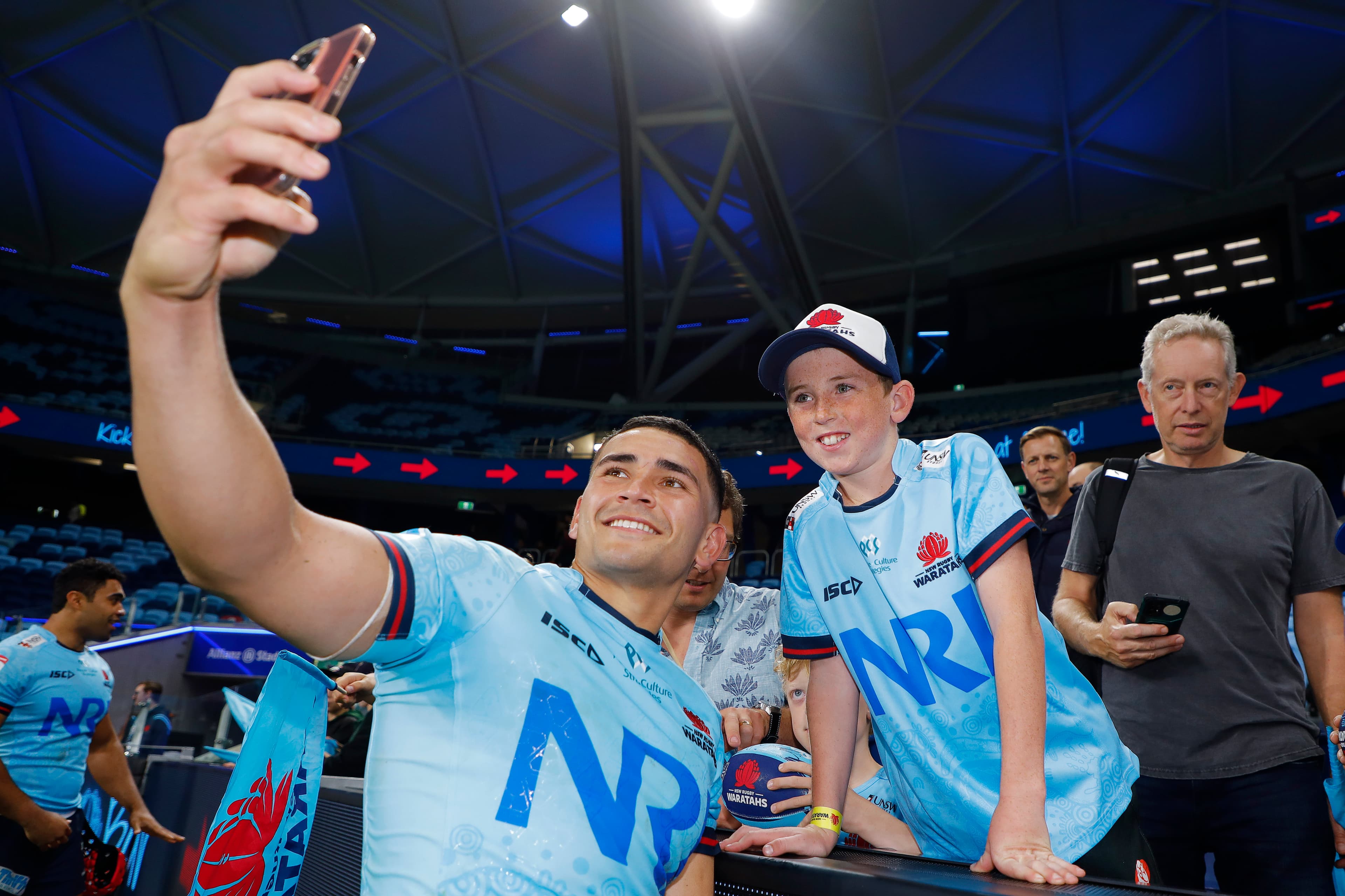 Izaia Perese takes a selfie with a Waratahs fan