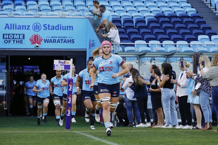 Piper Duck leads out the NSW Waratahs