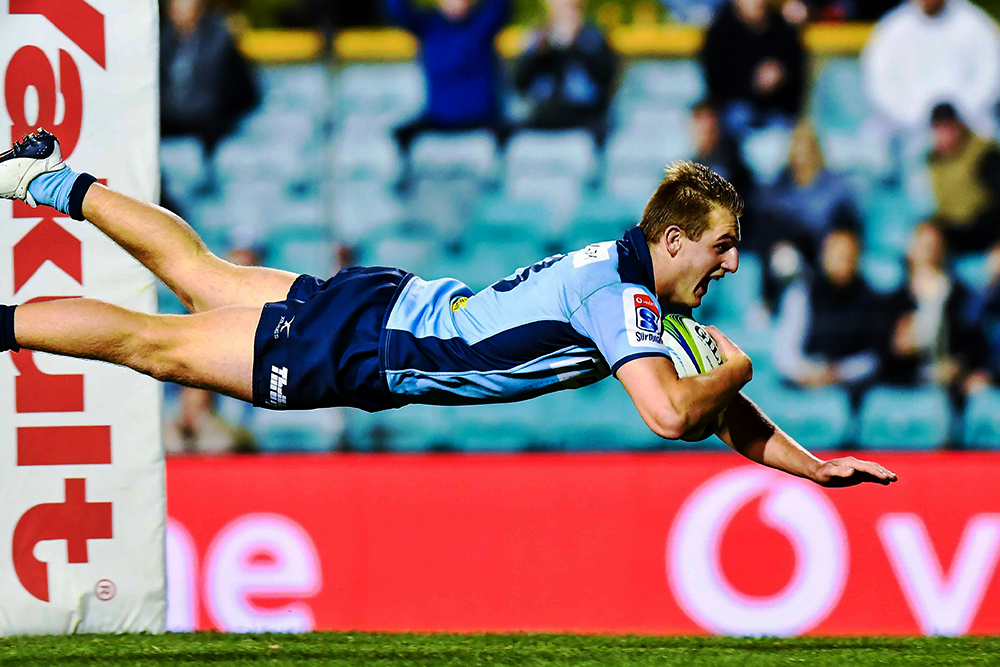 Joey Walton going over against the Melbourne Rebels. Photo: Keith McInnes